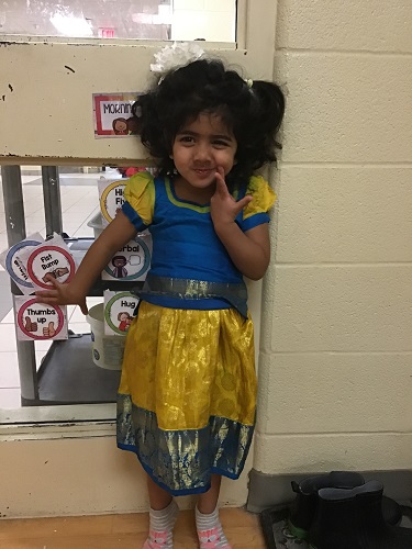 A child wearing her familie's traditional clothing